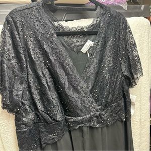 Black 2x dress. New with tags. Mid calf length